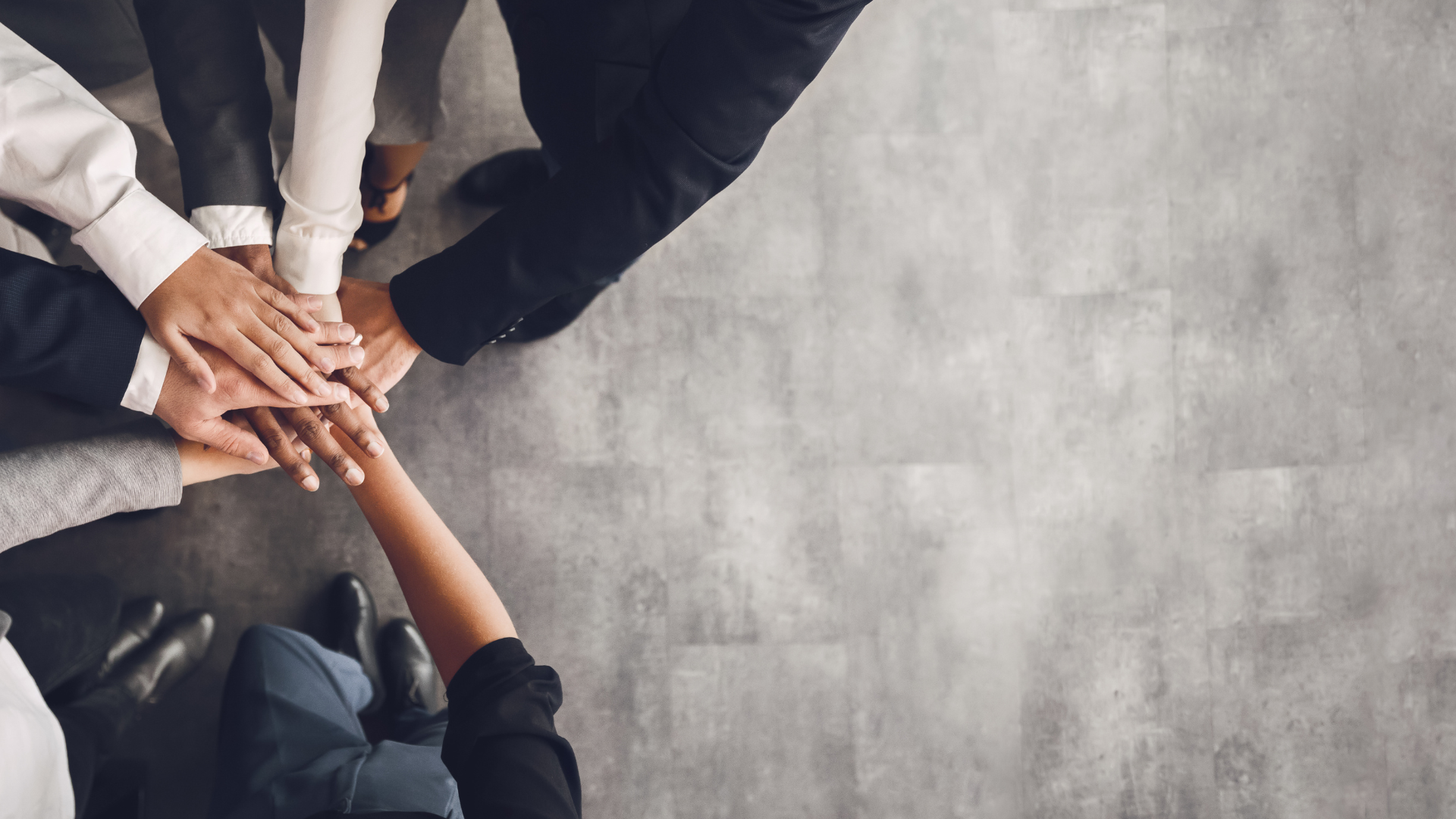 Attorneys and legal professionals joining their hands as a team