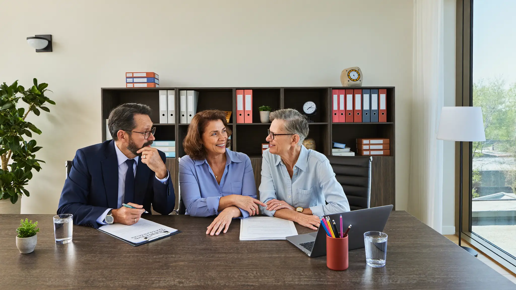 Estate attorney reviewing probate and estate administration documents with a client